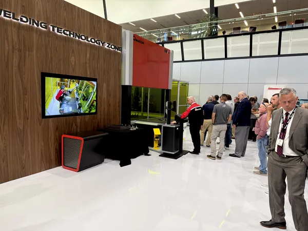 Visitors watching a live welding demonstration